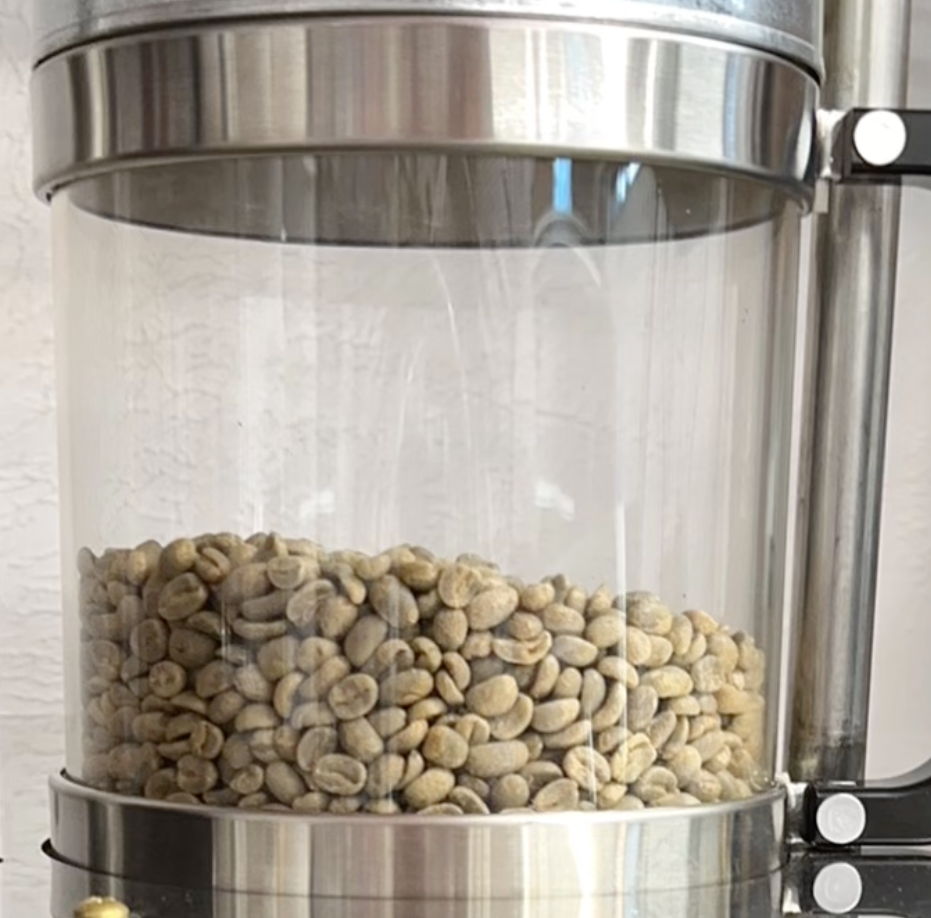 Green beans in roasting chamber by Aurora's Cup Coffee